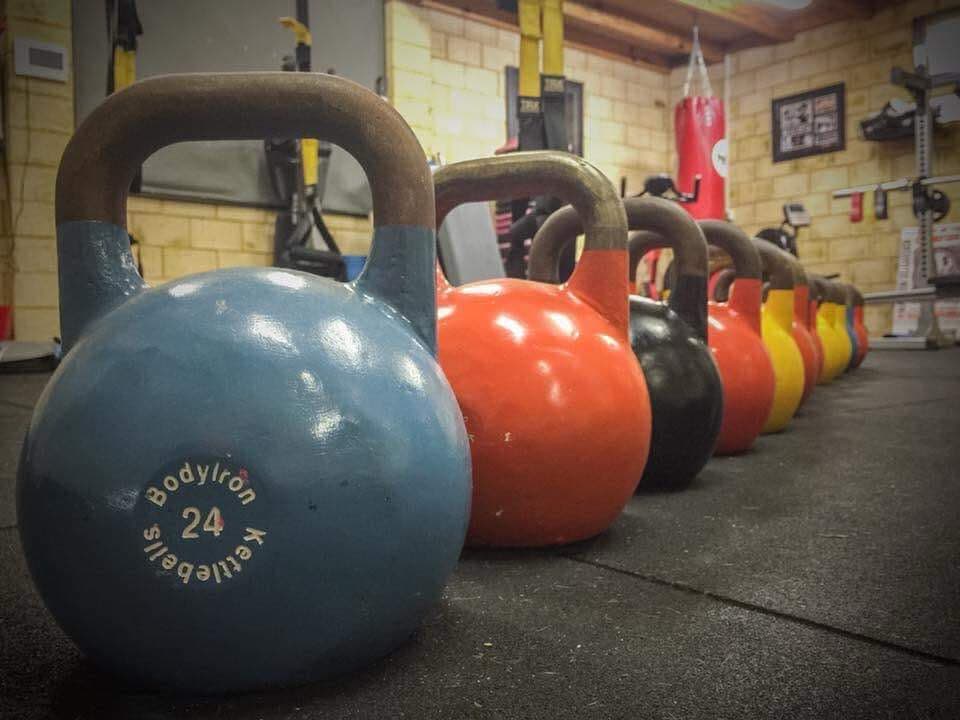 Competition kettlebells lined up at Hell's Bells Fitness Ballajura